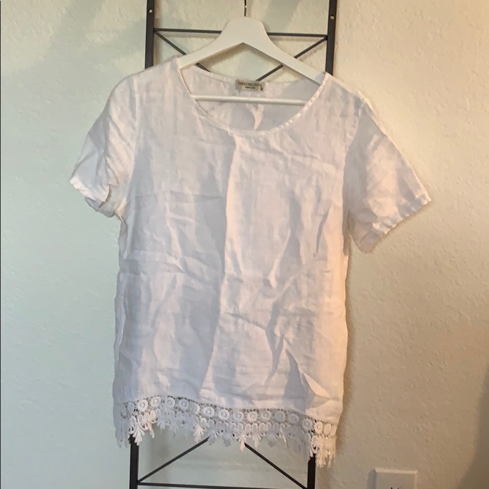 White blouse with lace detail at the bottom